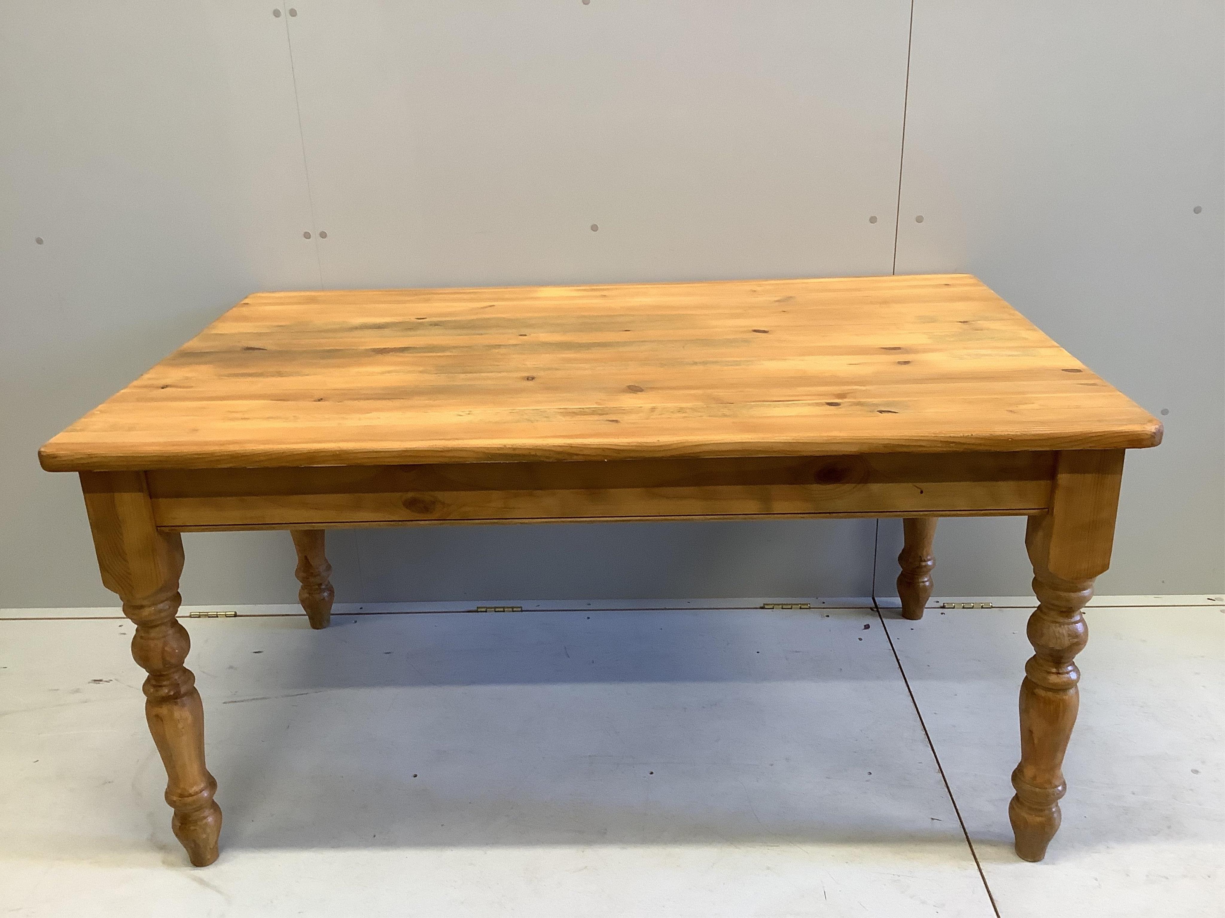 A modern pine kitchen table and four golden oak chairs, width 152cm, depth 93cm. Condition - some staining to the table top, wear and fading to the chairs